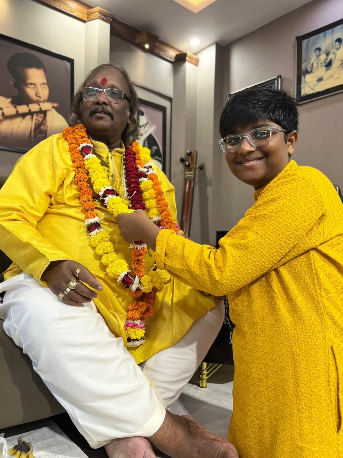 Rishal Prasanna offering Garland to Guruji on Guru Poornima